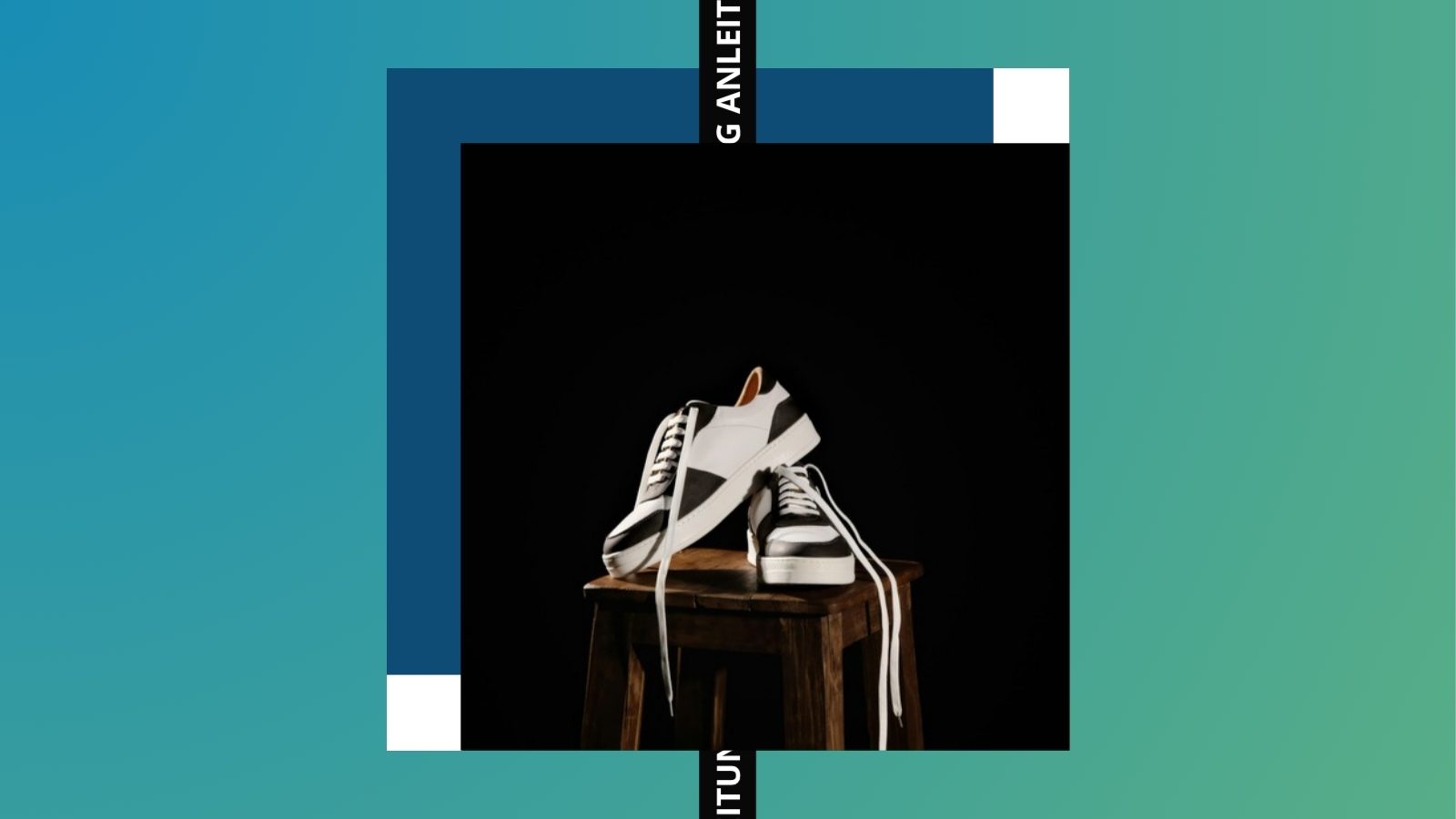 Schwarz-weiße Leder-Sneaker auf einem Holzhocker vor dunklem Hintergrund